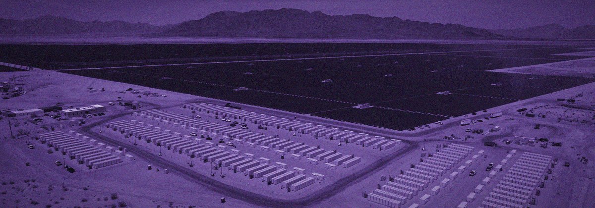 Utility-scale solar panels under a clear sky